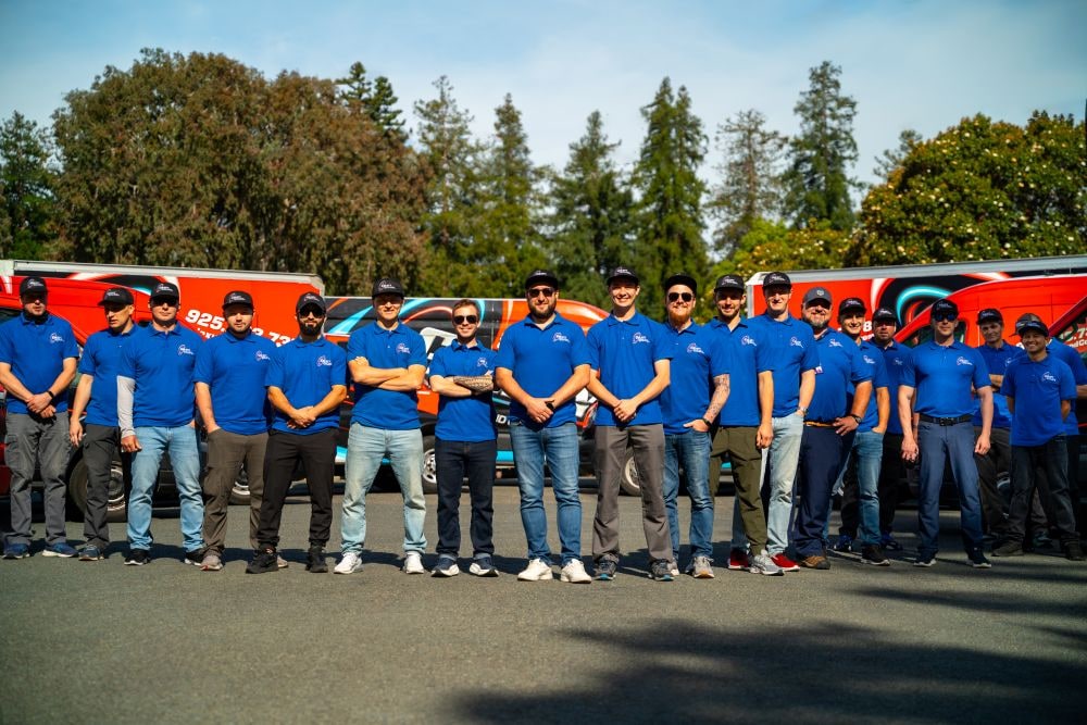 Galaxy Heating & Air Conditioning professional team in front of service trucks