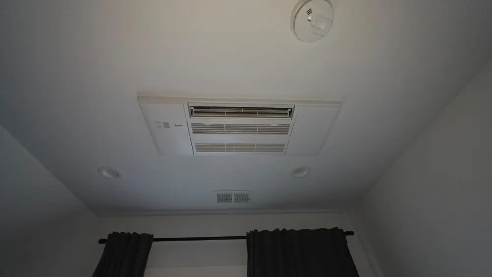 Mitsubishi Electric ceiling cassette unit recessed into a bedroom ceiling