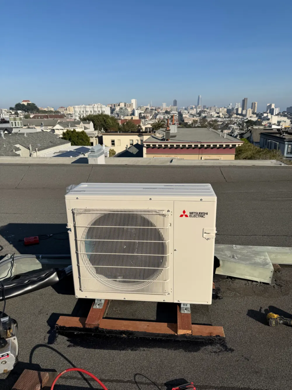 Mitsubishi heat pump mounted on a rooftop in San Francisco