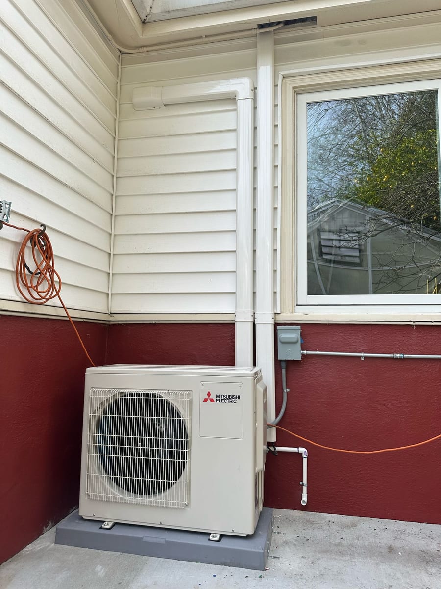 Mitsubishi ductless heat pump outdoor unit installed by Galaxy Heating & Air at an Albany home near Solano Avenue