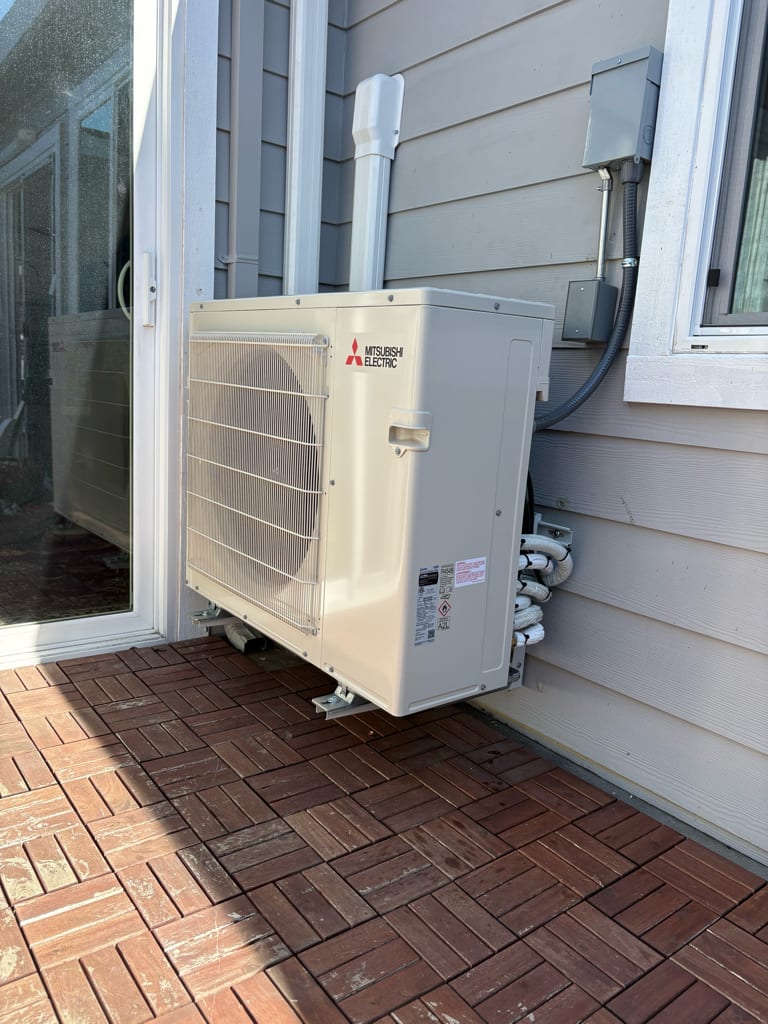 Mitsubishi heat pump outdoor condenser installed by Galaxy Heating & Air at a Warm Springs Fremont home