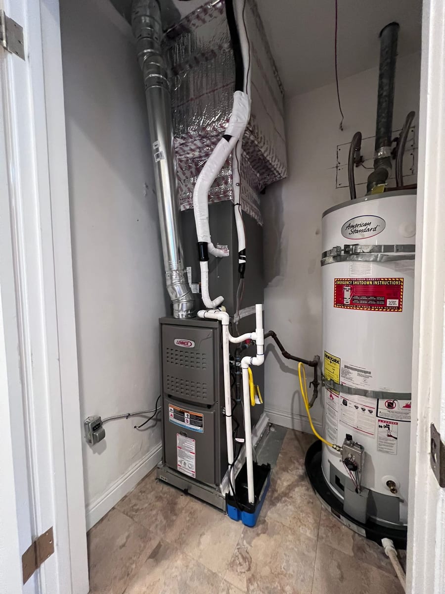 Lennox gas furnace and American Standard water heater installed by Galaxy Heating & Air in a utility closet at a Mt. Eden Hayward home