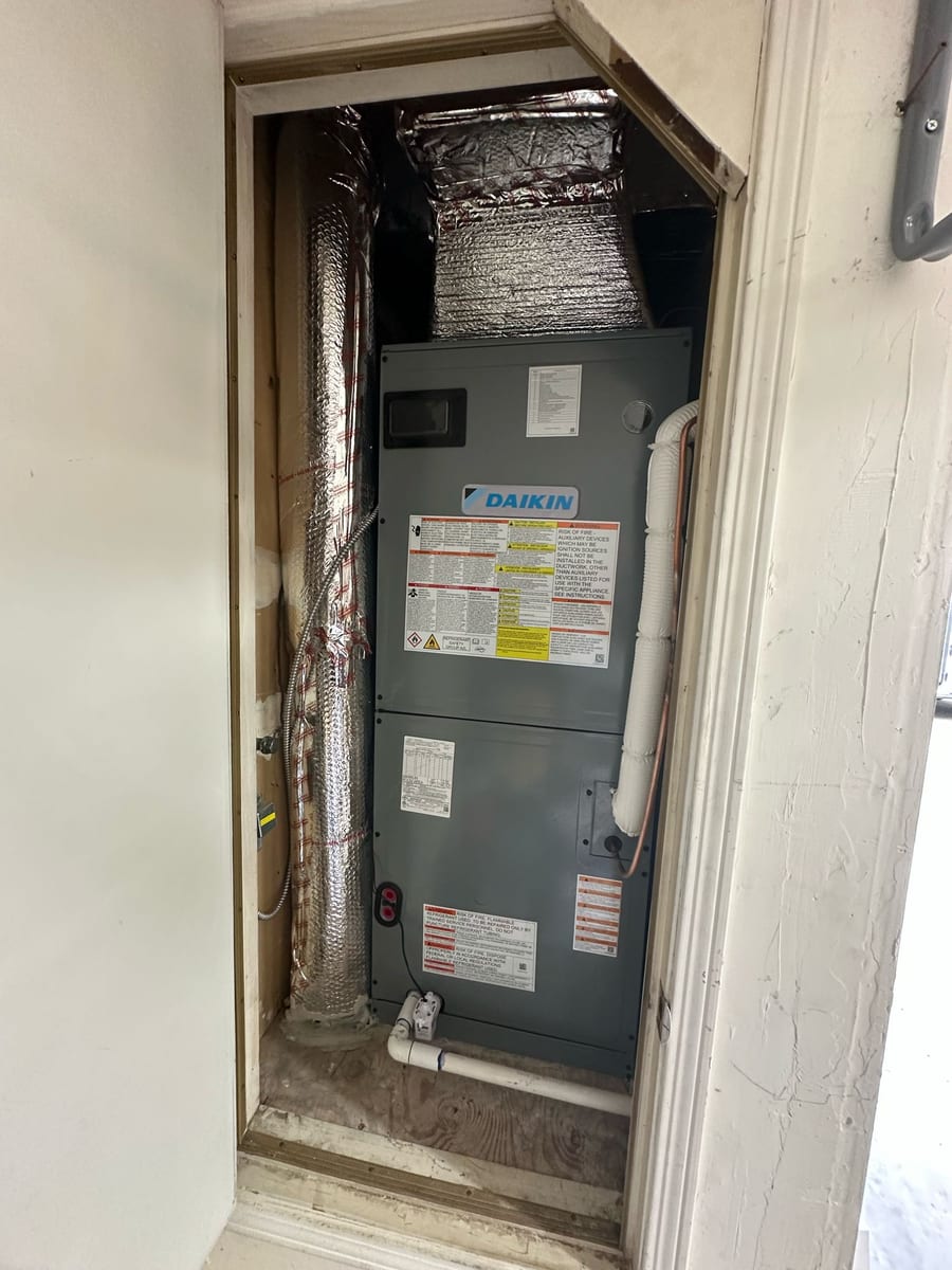 Daikin variable-capacity air handler installed by Galaxy Heating & Air in a utility closet at a Piedmont home