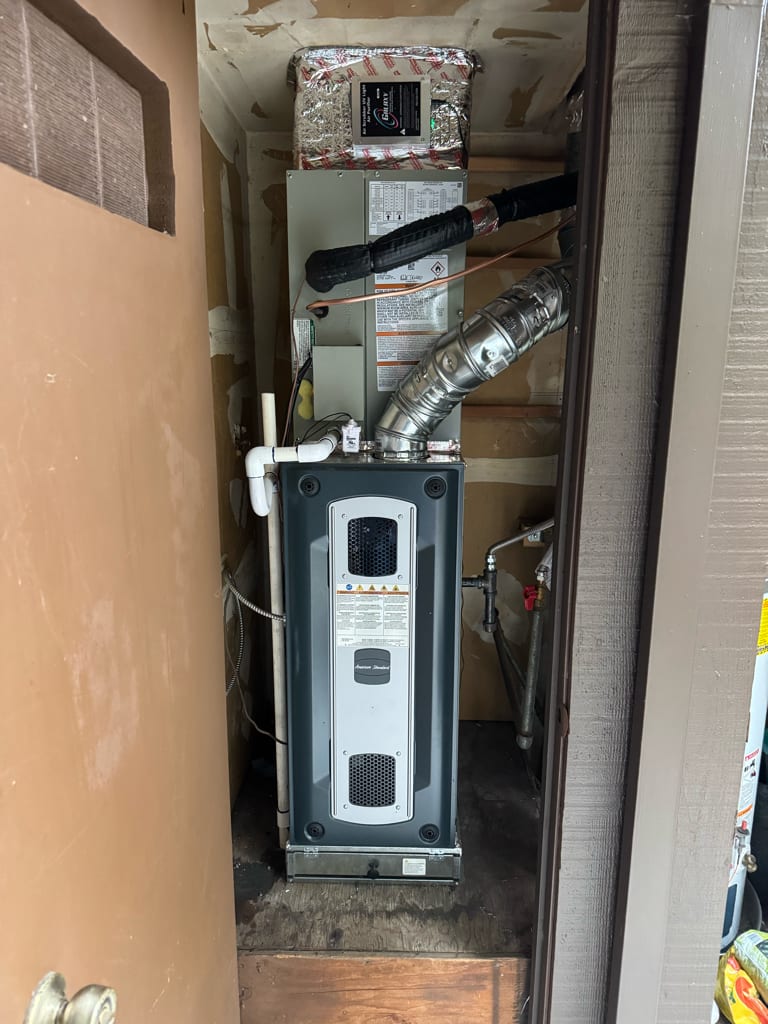American Standard 80% AFUE gas furnace installed by Galaxy Heating & Air in a tight utility closet at a Grayson Woods Pleasant Hill home