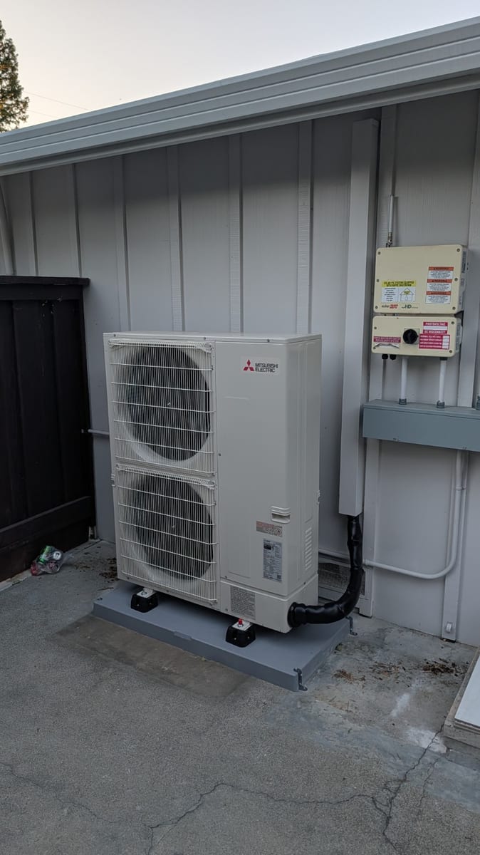 Mitsubishi 48,000 BTU PUZ-AK48NL R454B inverter heat pump outdoor unit installed by Galaxy Heating & Air at a Gregory Gardens Pleasant Hill home