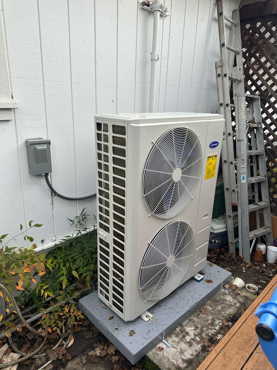 Carrier 2-fan inverter-driven heat pump outdoor unit installed by Galaxy Heating & Air at a Westside San Ramon home