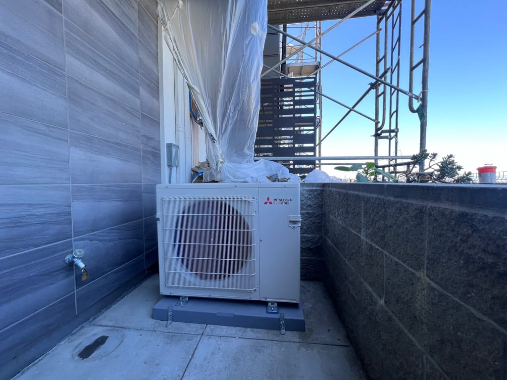 Mitsubishi heat pump outdoor unit installed by Galaxy Heating & Air at a Noe Valley San Francisco Edwardian home