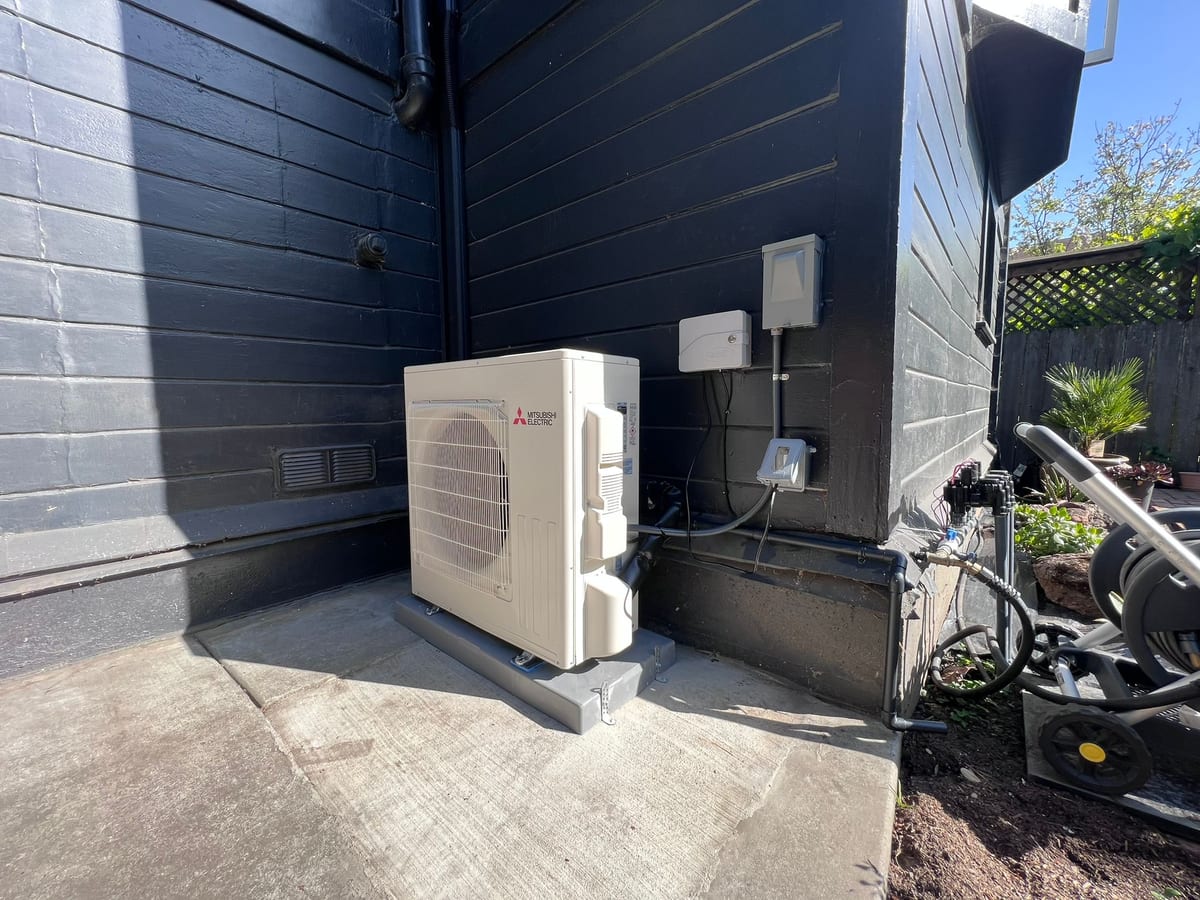 Mitsubishi Electric ductless heat pump outdoor unit installed by Galaxy Heating & Air at a Sunshine Gardens South San Francisco home